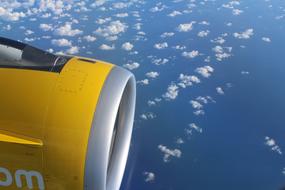 yellow airplane wing motor