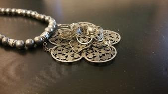 flower shaped metal medallion