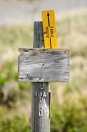 wooden plaque in the field