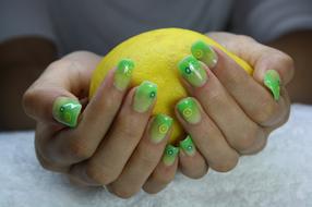sour lemon in the hands of a girl