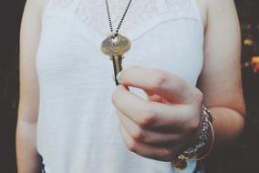 girl hands over the key