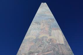 old obelisk with drawings