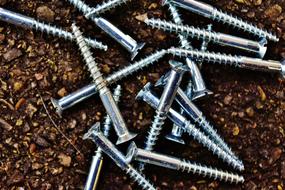 Metal shiny nails on the ground