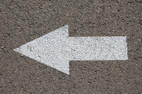 white arrow on asphalt