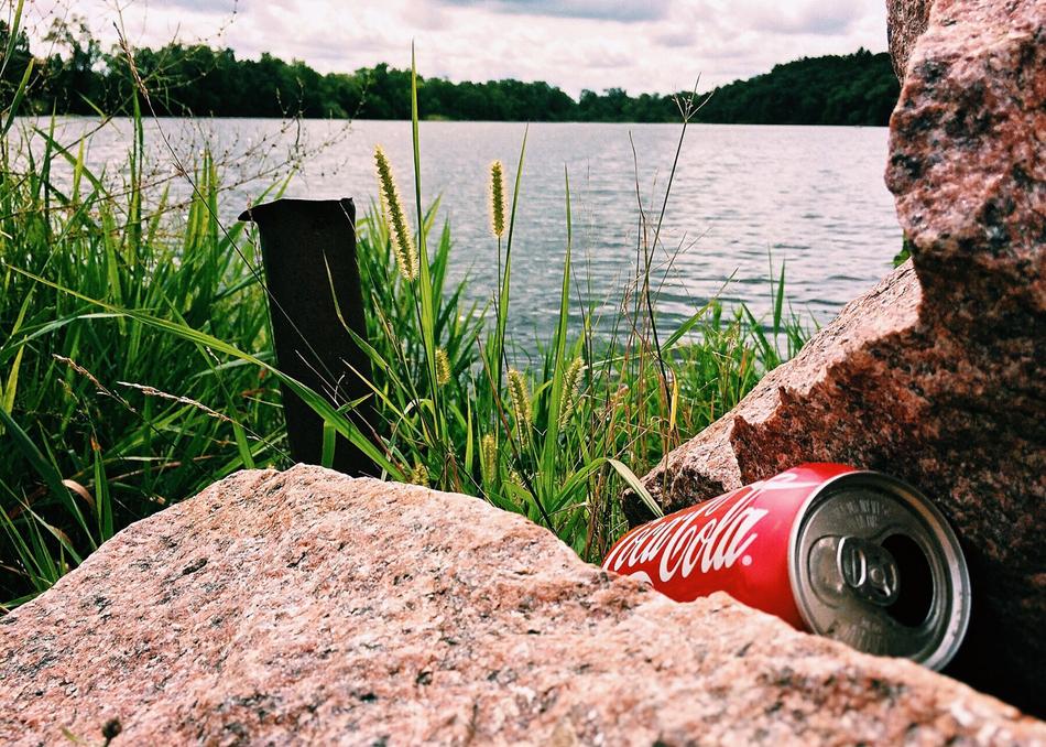 discarded can near the river