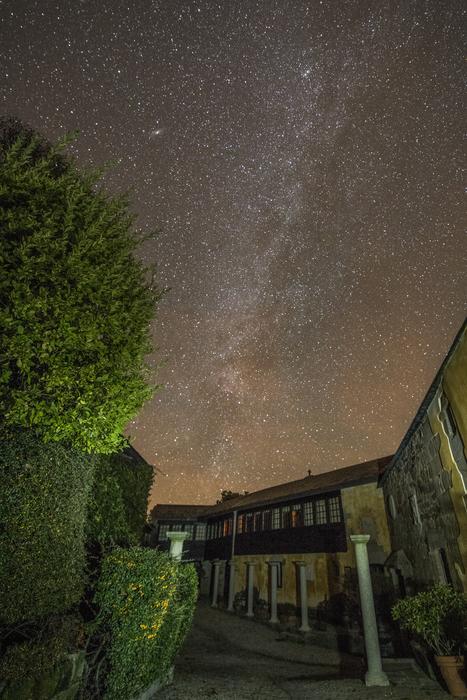 beautiful starry sky above the houses in the village