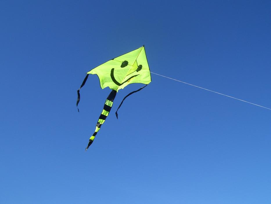 paper green kite in the sky