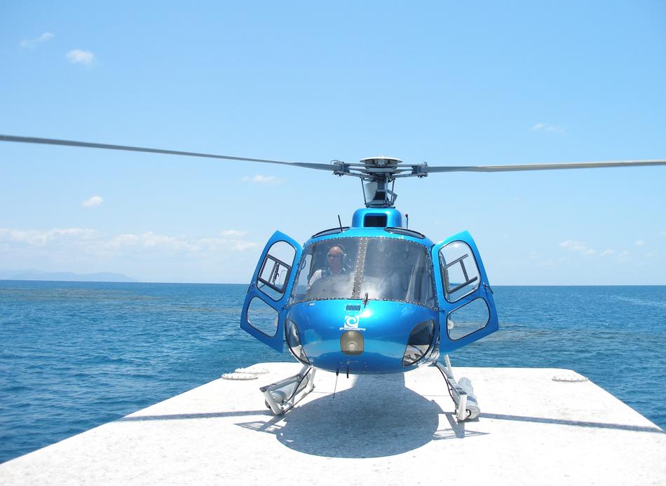 helicopter landing in front of the sea