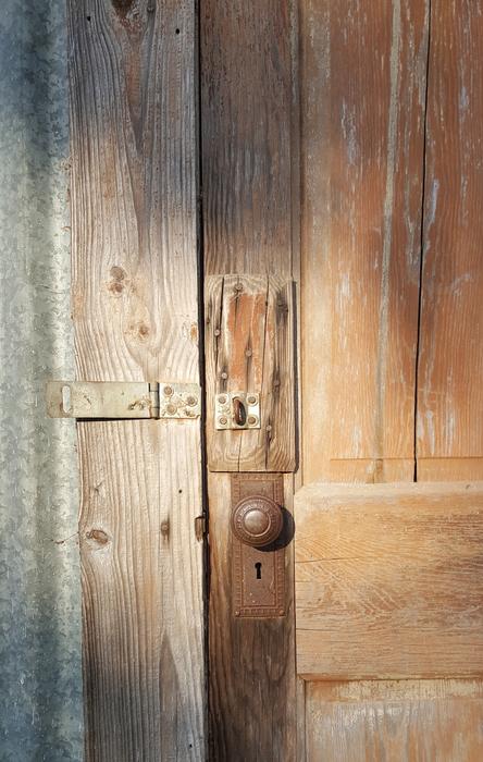 wooden door lit by the sun