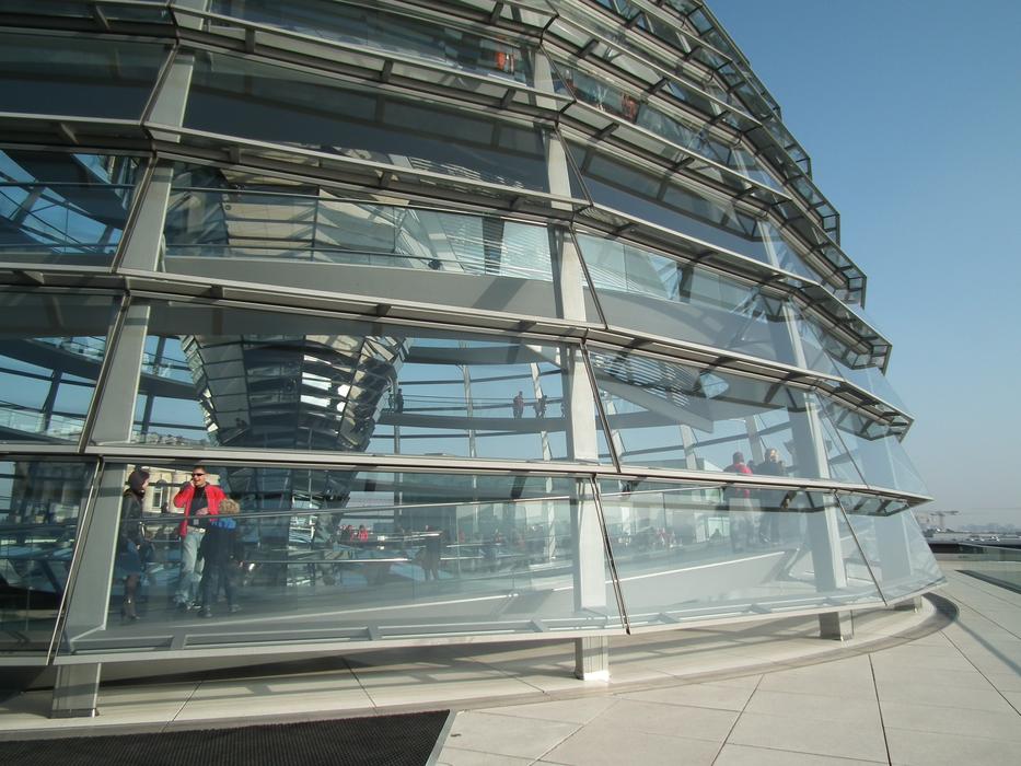 people in a glass building