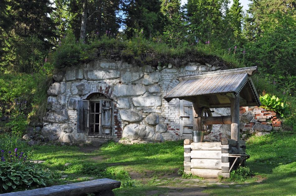 Beautiful landscape with the stone building among the plants, in the forest in Solovki, Russia
