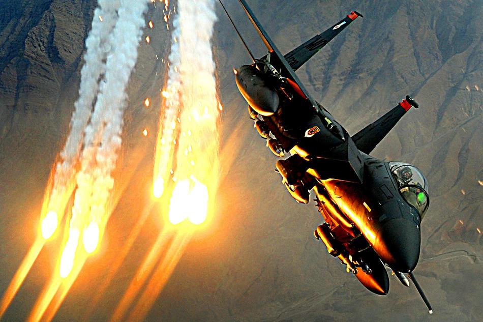 Military Jet Launching Heat decoys in Flight