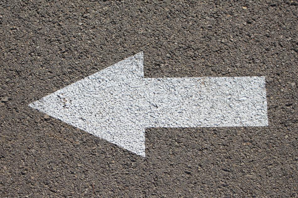 white arrow on asphalt