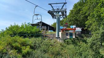 green hills with ski lifts