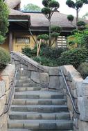 stone stairs with railing near traditional building, Japan, Epcot Center