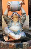 statue of a man with barrel