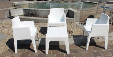 white chairs near the fountain