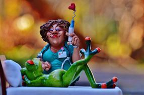 Funny figure of a nurse and a frog