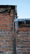 cold icicles on the roof of the house
