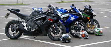Three Motorcycles Placed Side View