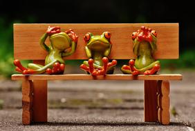three Frogs on bench, funny figurines, hear no evil, see no evil, speak no evil