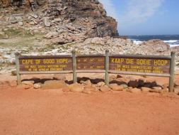 wooden sign on the beach