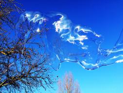 Huge Soap Bubble at blue sky