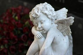 white sculpture of a sweet angel