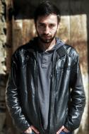 serious man in a jacket