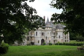 Château De Vigny Facade behind trees at summer, France