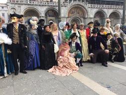 people in beautiful costumes and masks