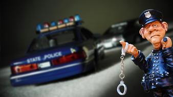 Policeman figure next to the car