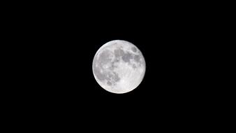 onely moon in a black sky