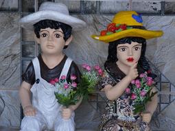 cute couple sculptures outside the house