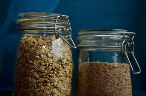 Seeds in a jar on a blue background