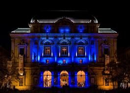 building in a colored glow at night