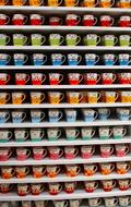 Colorful cups on the shelves
