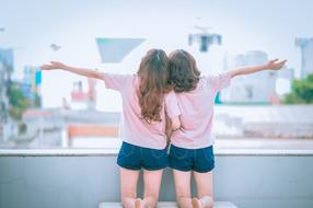 happy girlfriends with the city as a backdrop