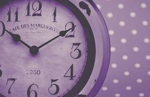 clock on purple background