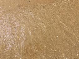 steep water in the sand