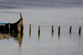 wooden poles in a cold sea