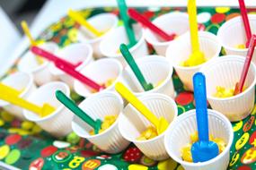colored spoons in glasses