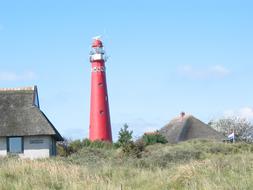 red lighthouse in the field