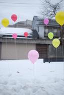 balloons in a snowy street