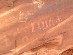 orange rock with drawings