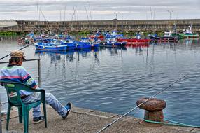 fisherman on the harbor by the sea