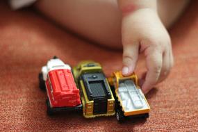 child is playing with toys