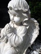 white stone sculpture of an angel