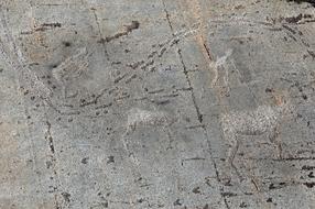 the stone wall of the building in the hole