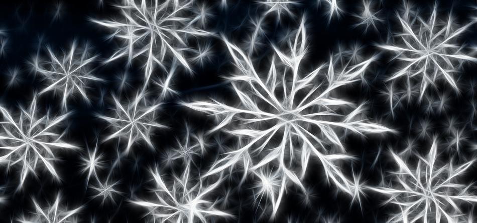 crystalline white snowflakes on a black background